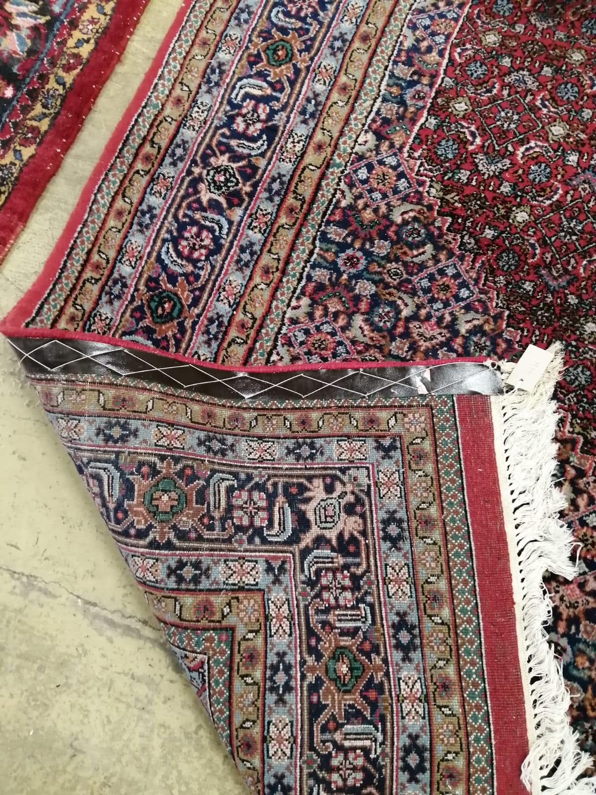 A Bidjar red ground carpet, 330cm x 223 cm